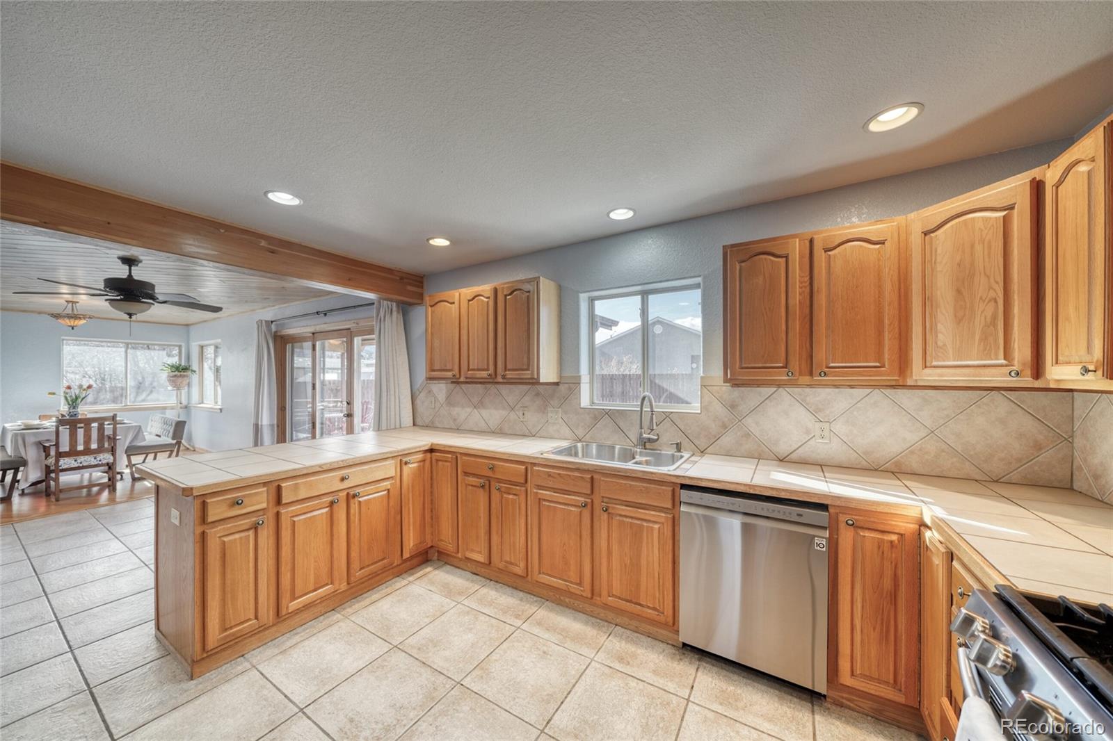 50 Rex Circle Salida, CO 81201 - Photo 20 of 50 a kitchen with a sink window and cabinets