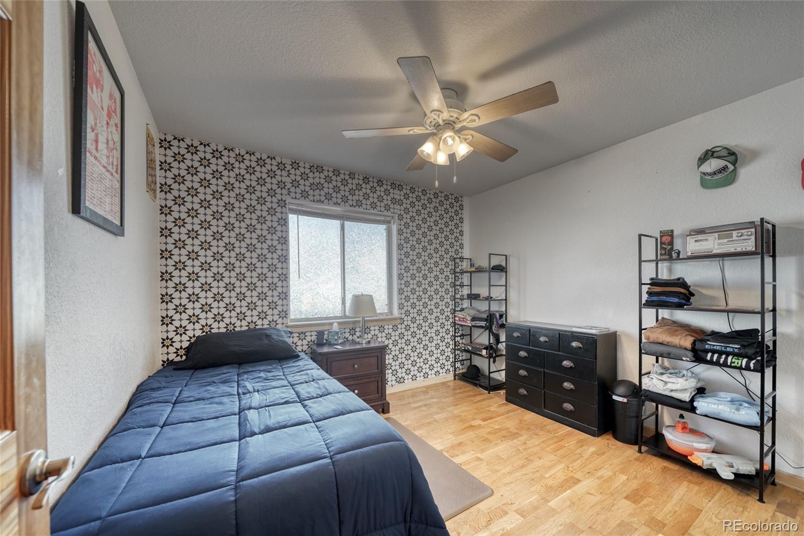 50 Rex Circle Salida, CO 81201 - Photo 30 of 50 a bedroom with a bed and a cabinets