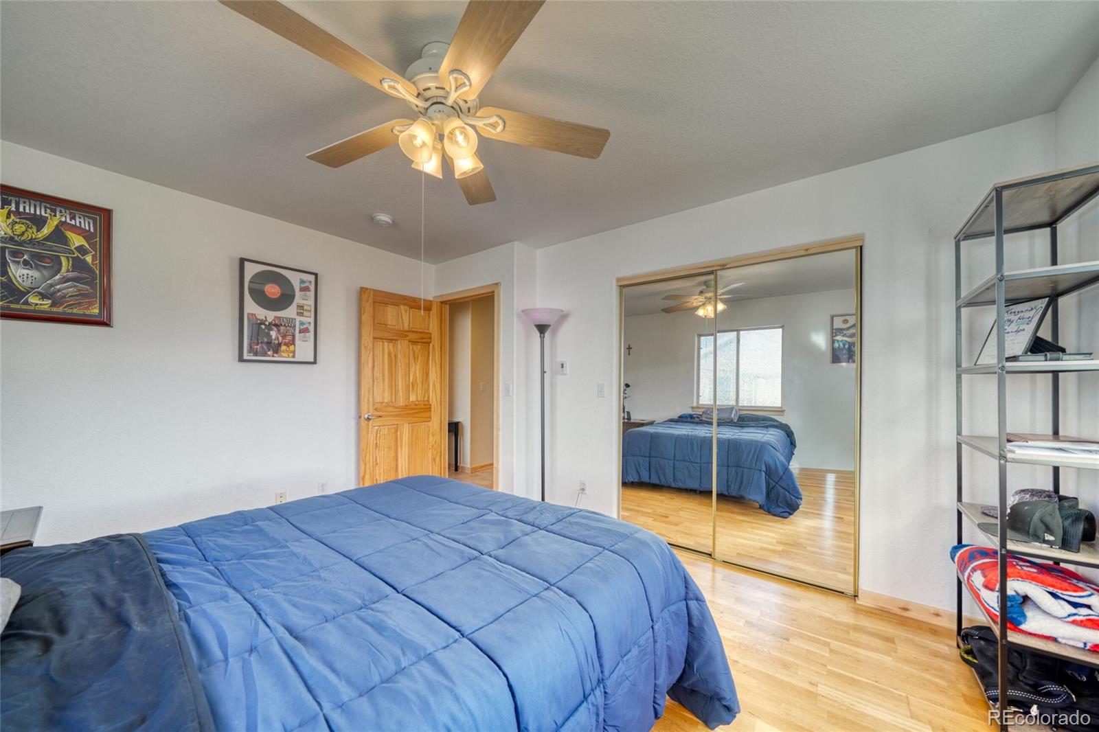 50 Rex Circle Salida, CO 81201 - Photo 33 of 50 a bedroom with a bed and a chandelier