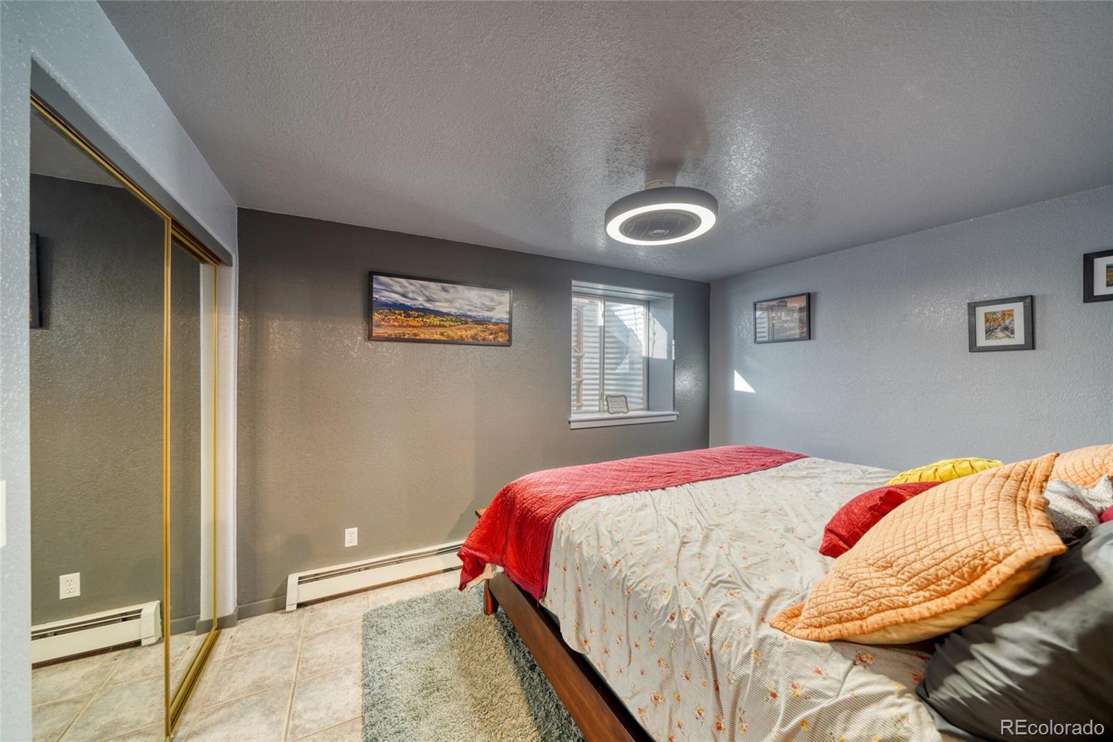 50 Rex Circle Salida, CO 81201 - Photo 45 of 50 a bedroom with a bed and a lamp