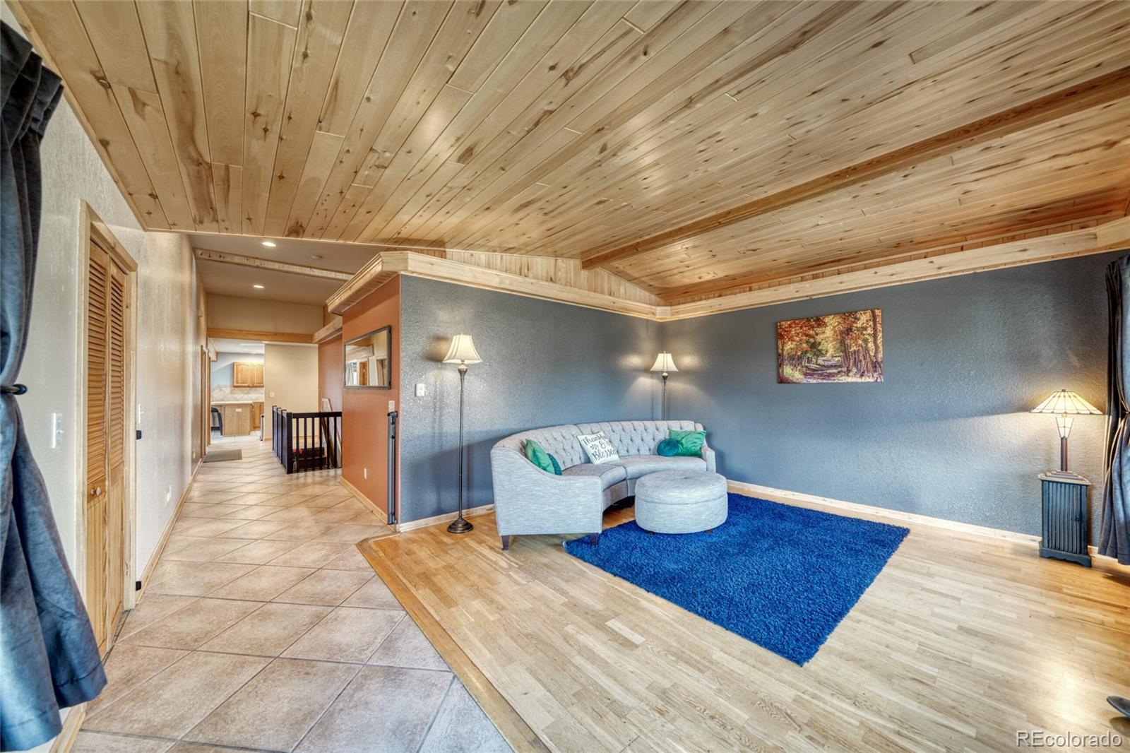 50 Rex Circle Salida, CO 81201 - Photo 7 of 50 a bedroom with a bed and a lamp on table