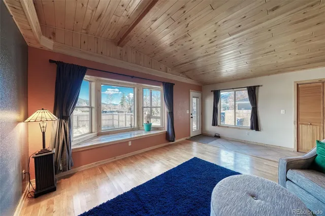 a view of livingroom with furniture wooden floor and windows