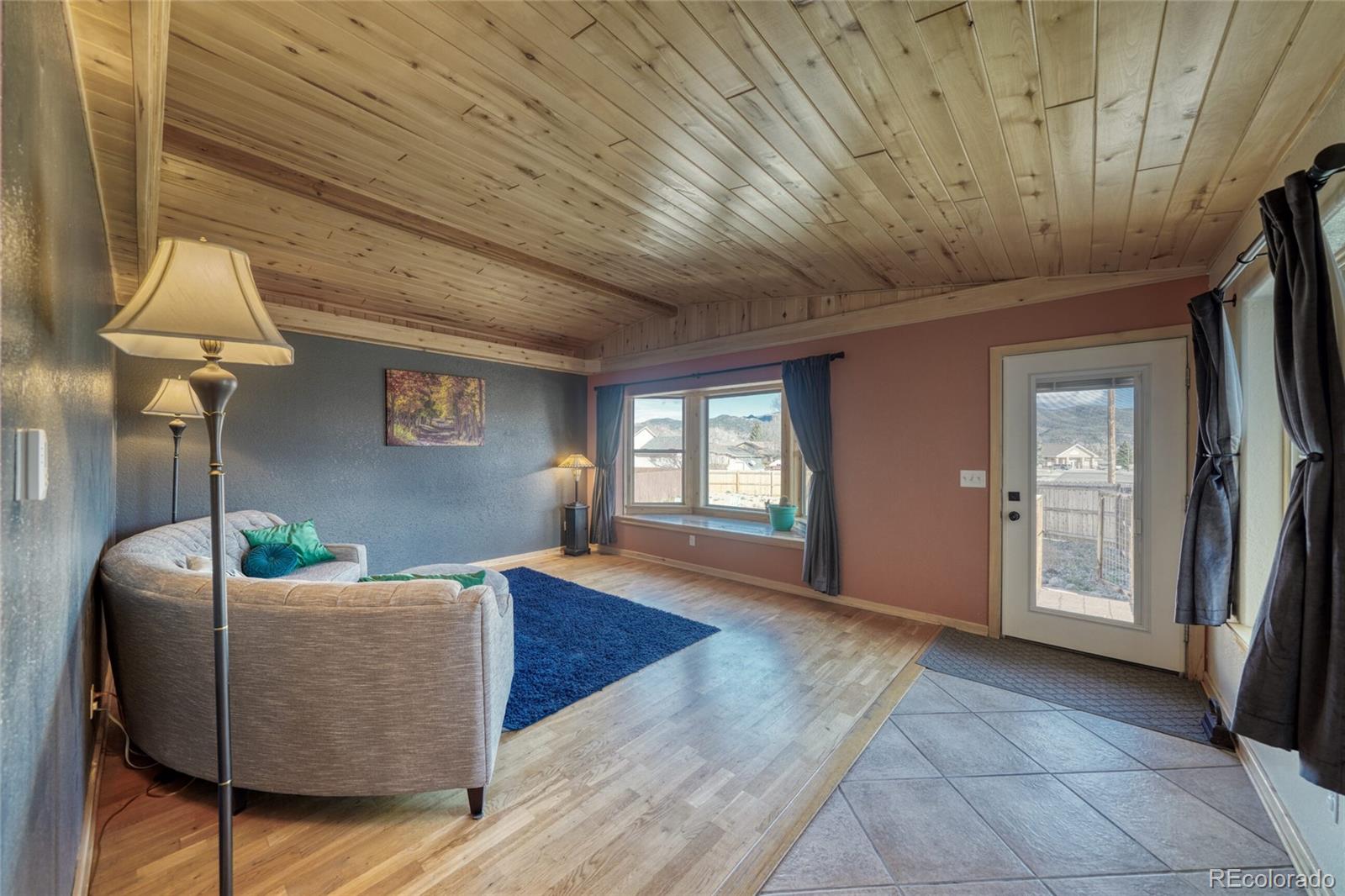 50 Rex Circle Salida, CO 81201 - Photo 10 of 50 a living room with furniture and a fireplace