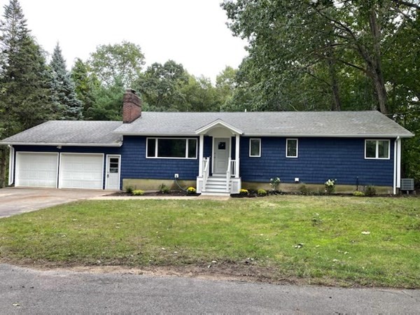 54 Summer Street North Andover, MA 01845 - Photo 1 of 25 a front view of a house with a garden