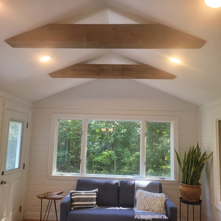 54 Summer Street North Andover, MA 01845 - Photo 11 of 25 a living room with furniture and a large window