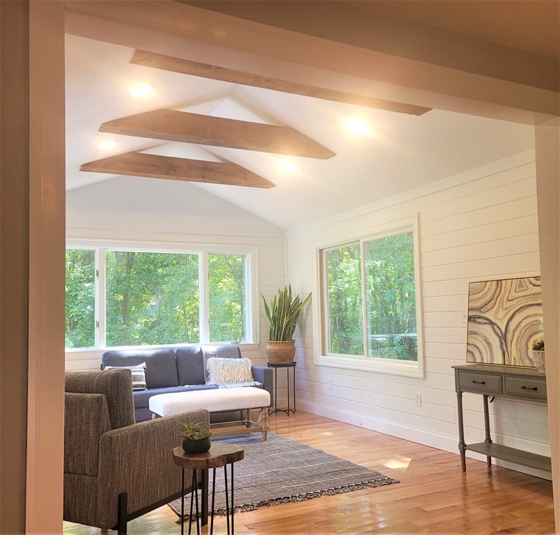 54 Summer Street North Andover, MA 01845 - Photo 12 of 25 a living room with furniture and a large window