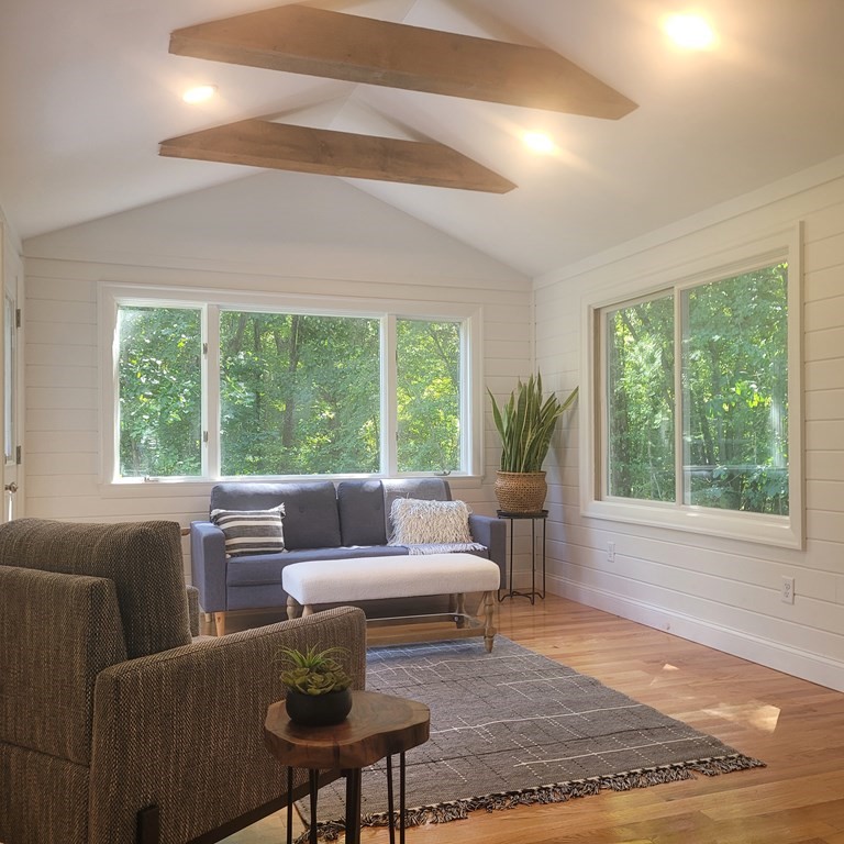 54 Summer Street North Andover, MA 01845 - Photo 13 of 25 a living room with furniture and a large window