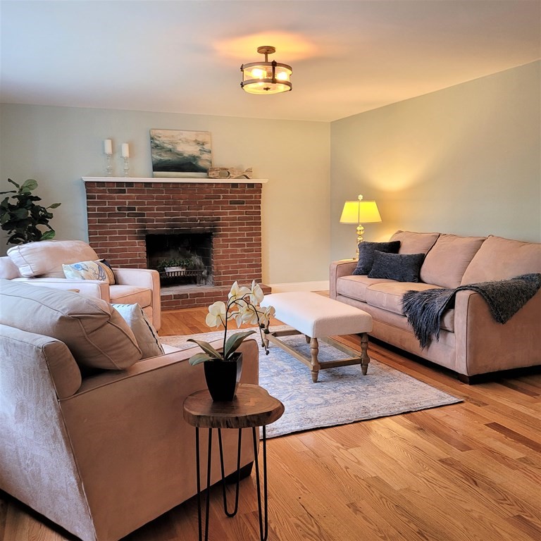 54 Summer Street North Andover, MA 01845 - Photo 14 of 25 a living room with furniture and a fireplace