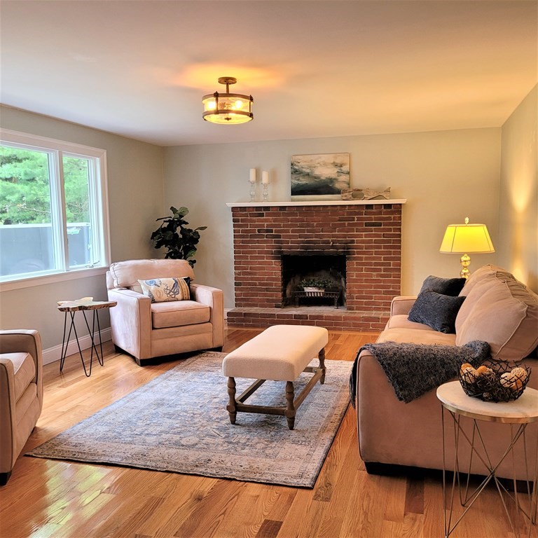 54 Summer Street North Andover, MA 01845 - Photo 15 of 25 a living room with furniture and a fireplace