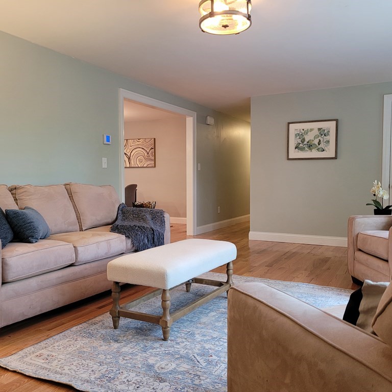 54 Summer Street North Andover, MA 01845 - Photo 16 of 25 a living room with furniture and a couch