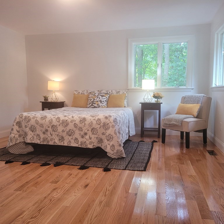 54 Summer Street North Andover, MA 01845 - Photo 17 of 25 a bedroom with a bed and a wooden floor