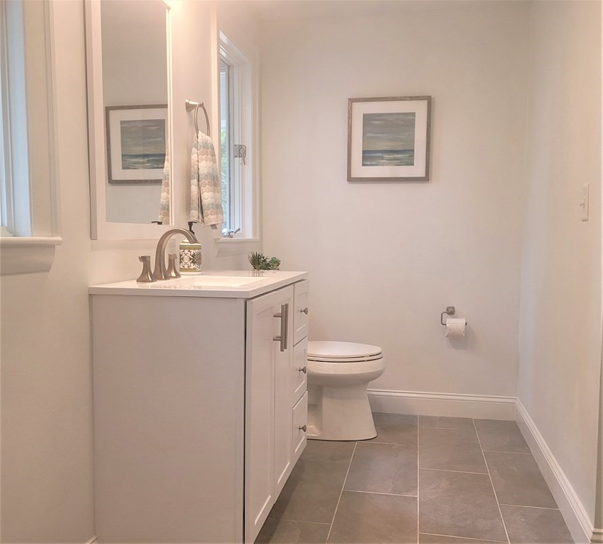 54 Summer Street North Andover, MA 01845 - Photo 21 of 25 a bathroom with a toilet sink and mirror