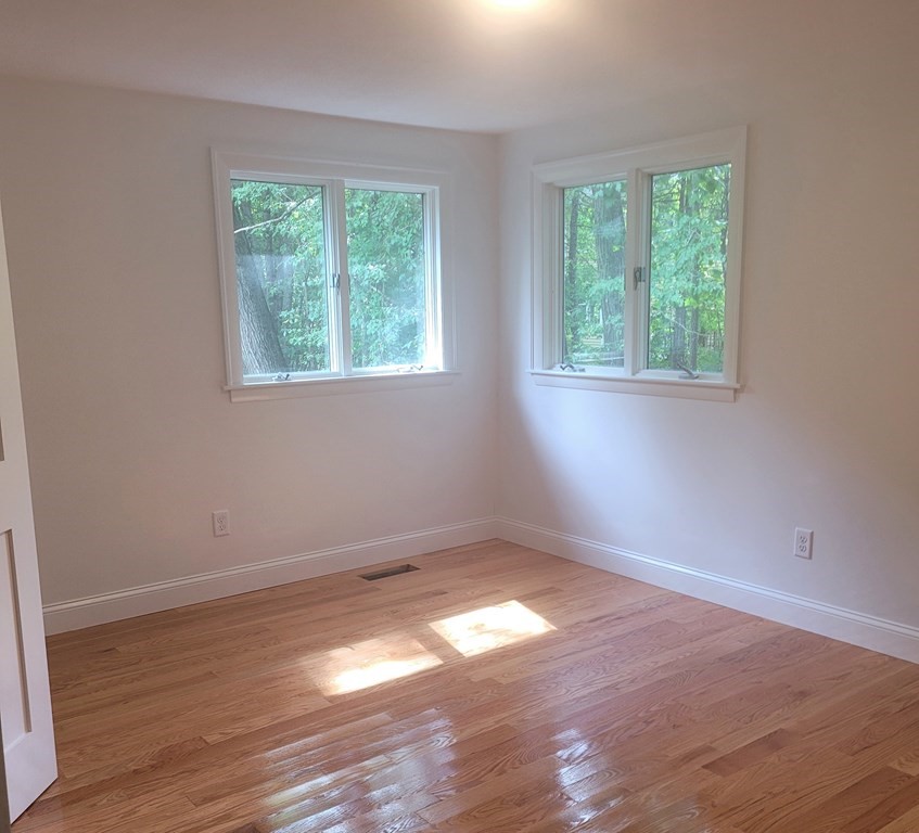 54 Summer Street North Andover, MA 01845 - Photo 23 of 25 an empty room with wooden floor and windows