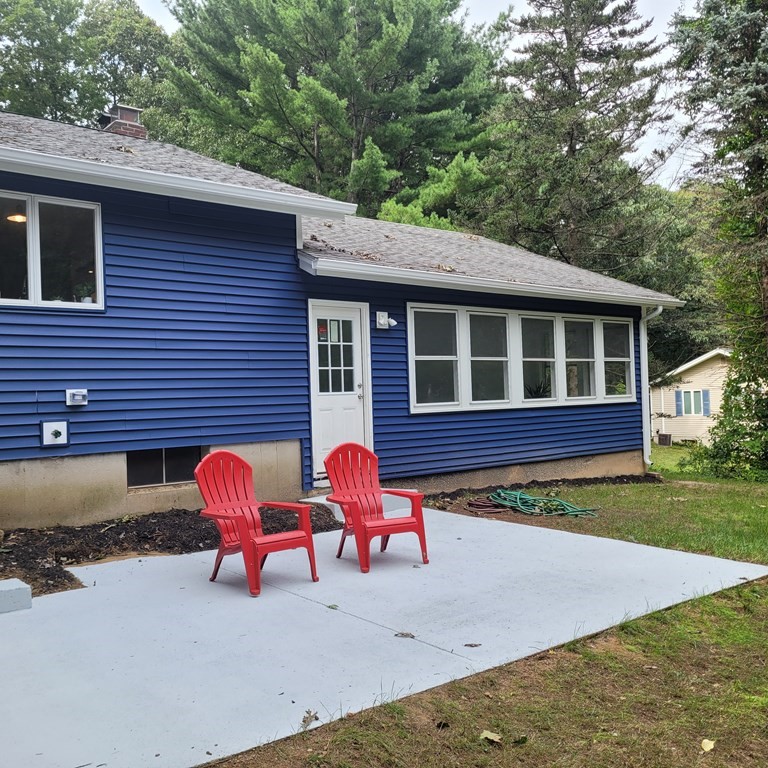 54 Summer Street North Andover, MA 01845 - Photo 3 of 25 a view of a house with a yard and a fire pit