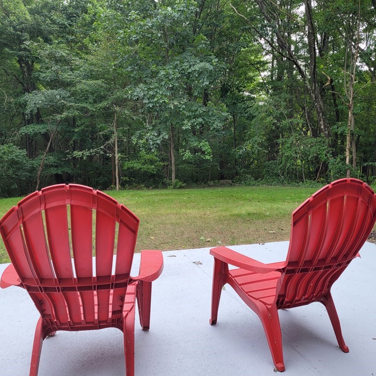 54 Summer Street North Andover, MA 01845 - Photo 4 of 25 a view of a chairs and backyard with a slide