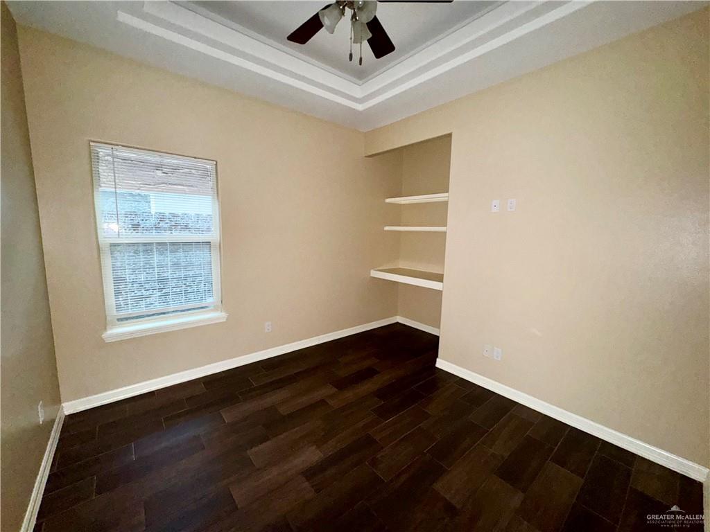 2004 Taft Street, Unit 1 Weslaco, TX 78599 - Photo 11 of 16 a view of an empty room with wooden floor and a window