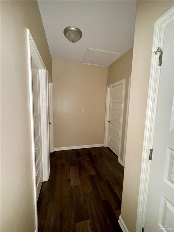 2004 Taft Street, Unit 1 Weslaco, TX 78599 - Photo 13 of 16 a view of an empty room with wooden floor and a window