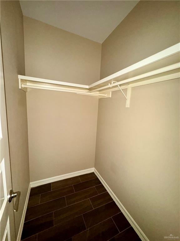 2004 Taft Street, Unit 1 Weslaco, TX 78599 - Photo 9 of 16 a view of a room with racks on the wall