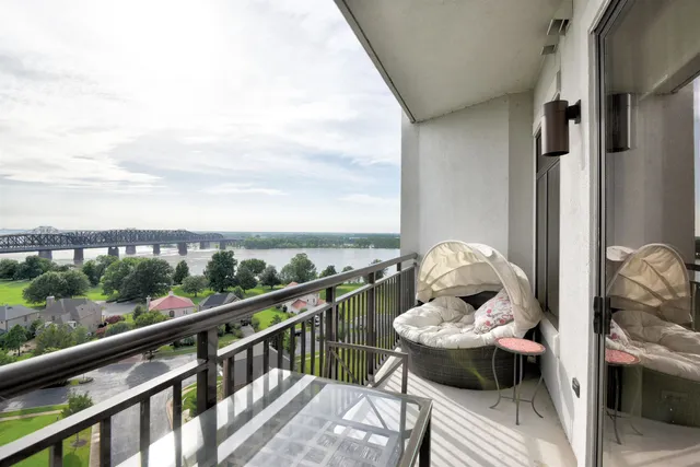 a view of a balcony with furniture