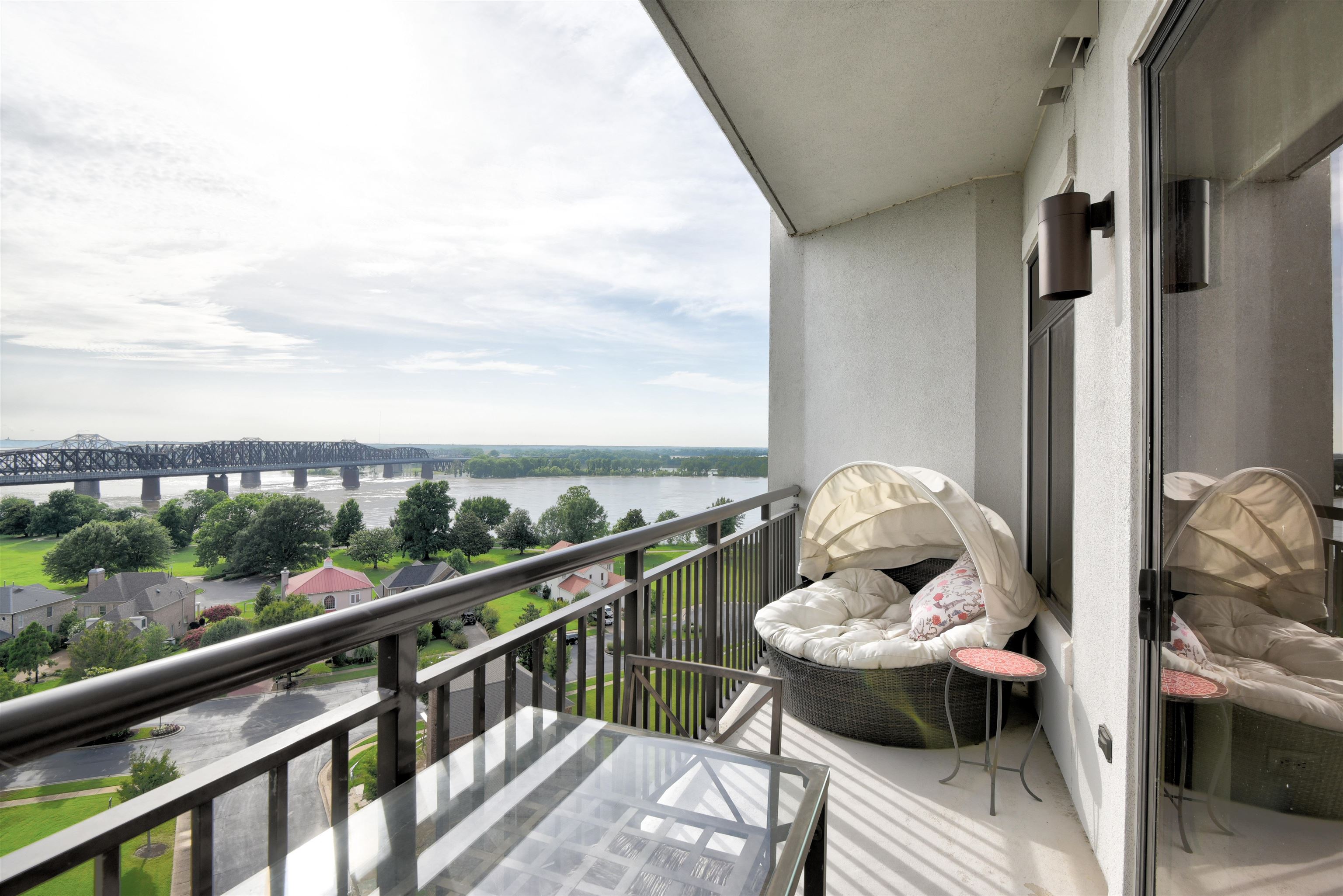 a view of a balcony with furniture