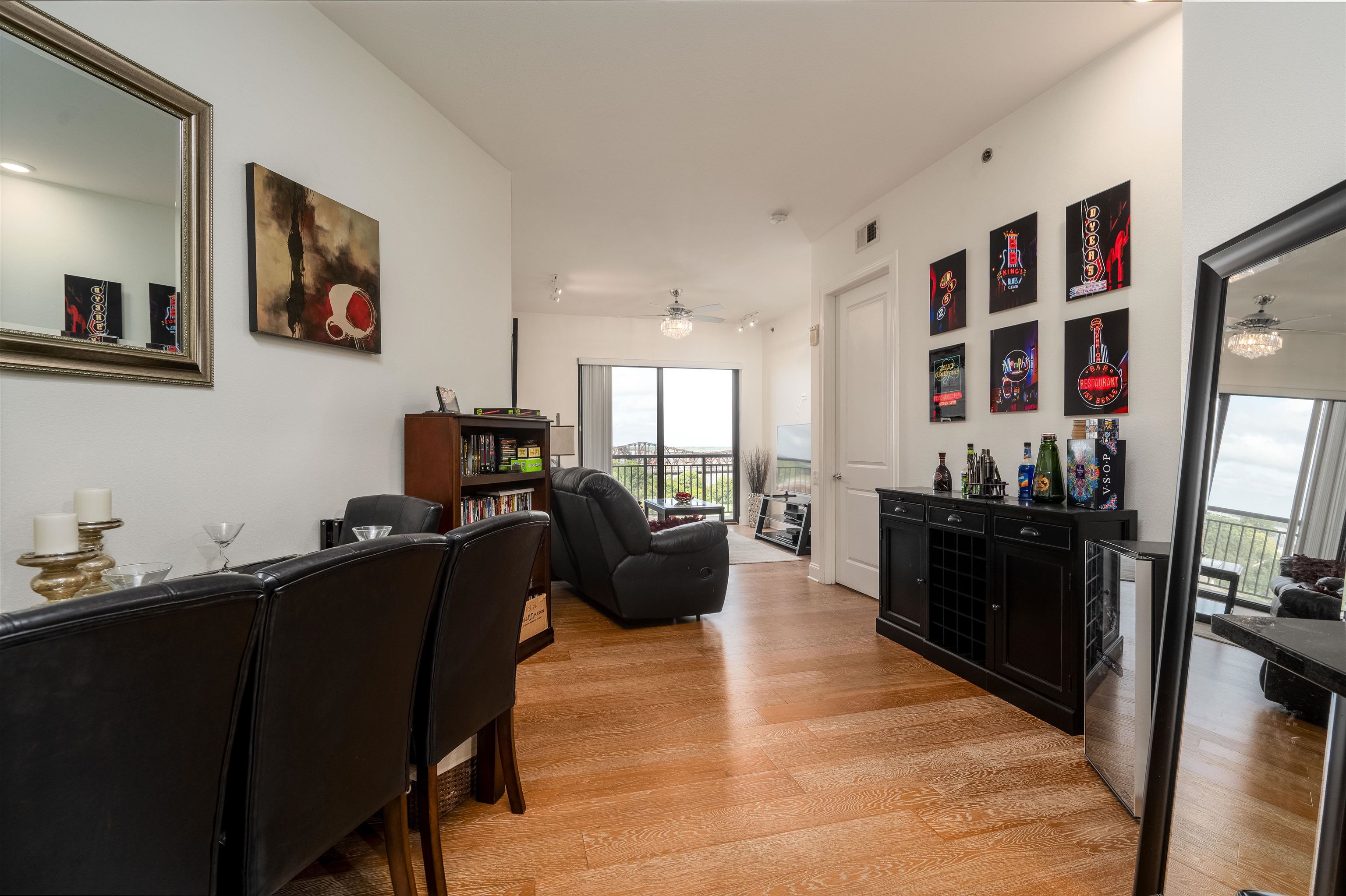 717 Riverside Drive, Unit 904 Memphis, TN 38103 - Photo 13 of 33 a living room with furniture and a flat screen tv