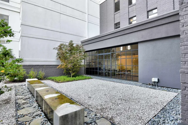 a view of entryway with a flower garden