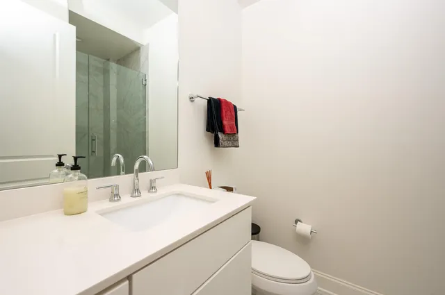 a living room with furniture and a book shelf