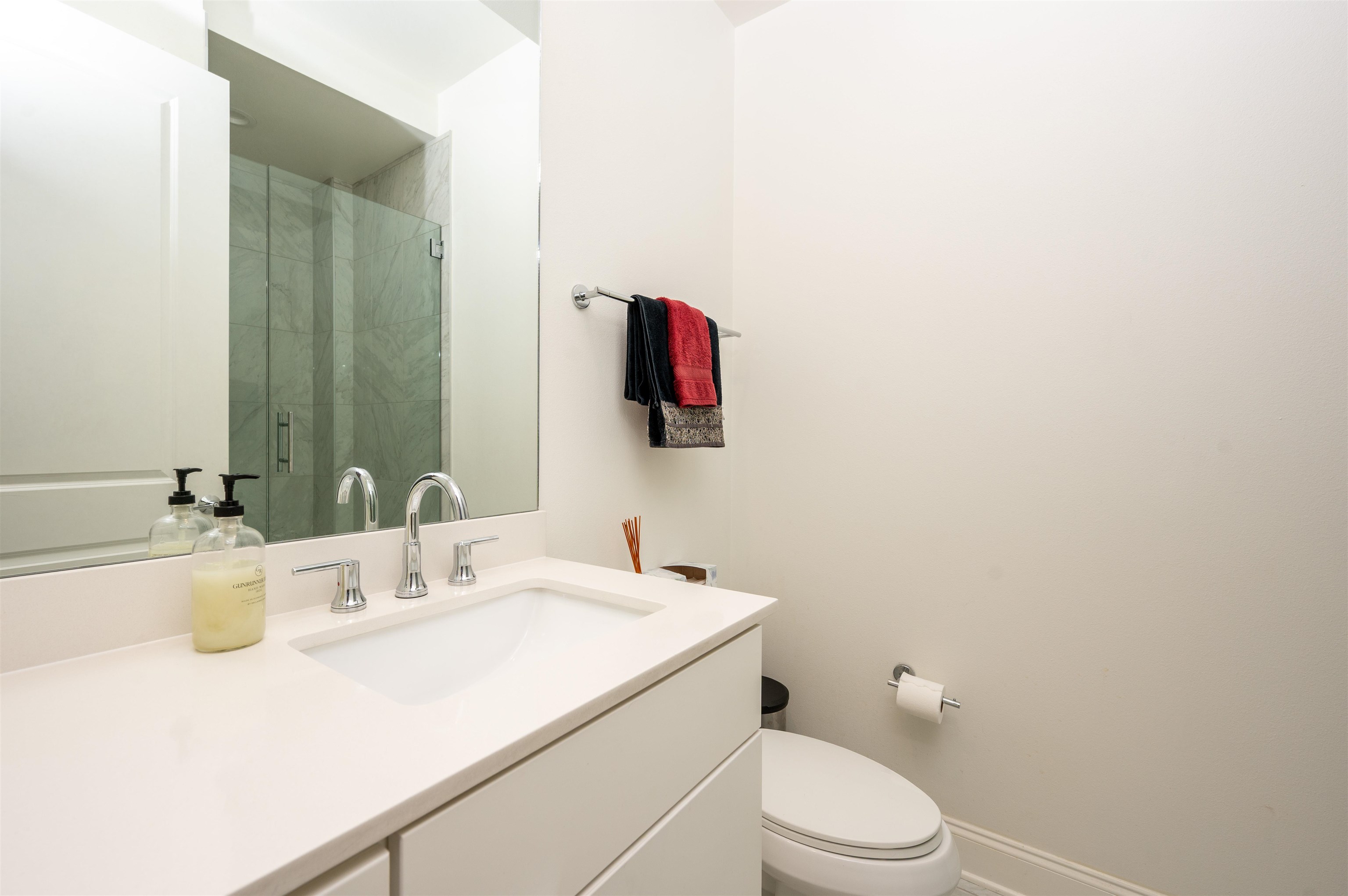 717 Riverside Drive, Unit 904 Memphis, TN 38103 - Photo 5 of 33 a bathroom with a sink vanity mirror and toilet