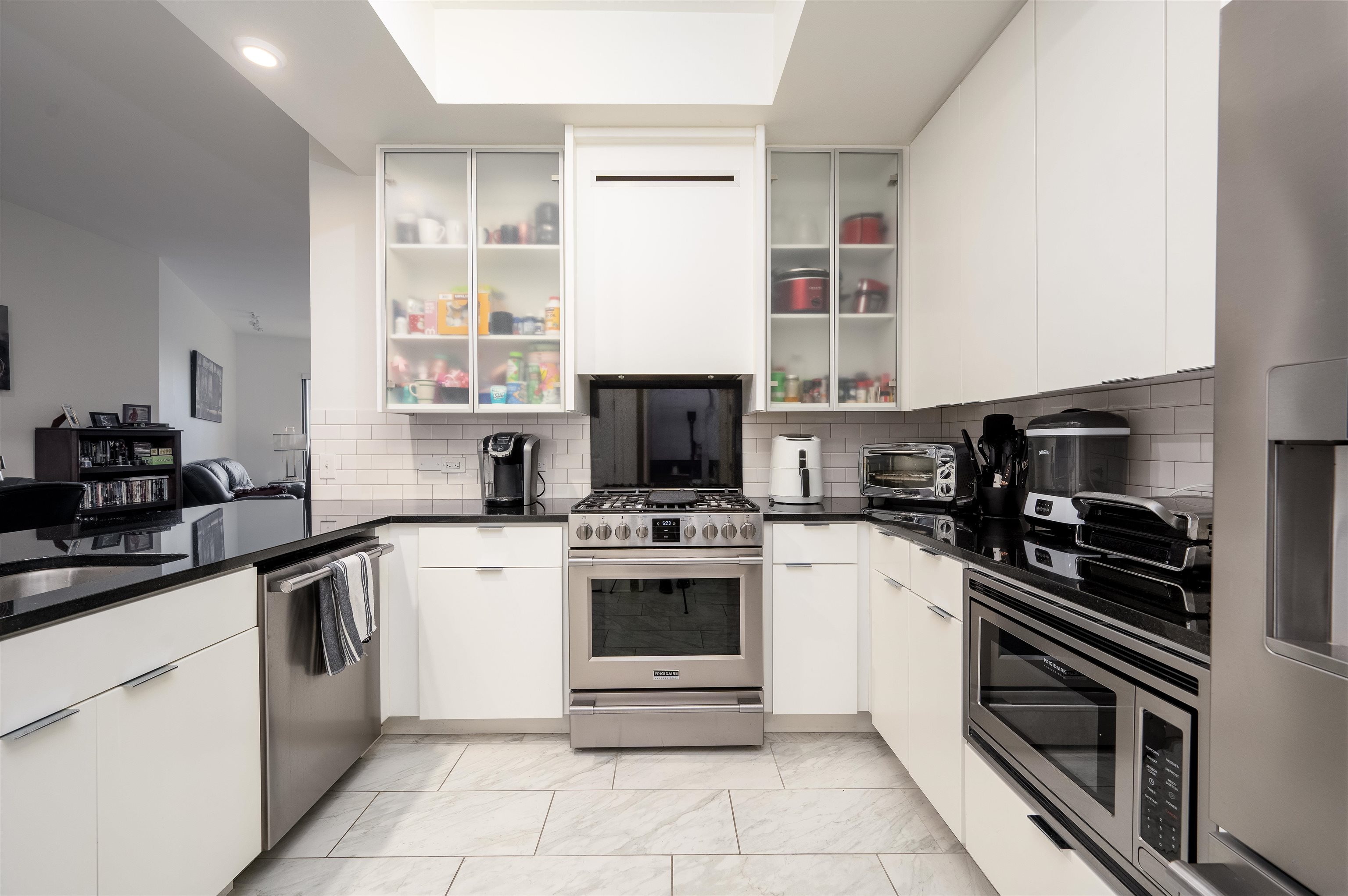 717 Riverside Drive, Unit 904 Memphis, TN 38103 - Photo 8 of 33 a kitchen with cabinets stainless steel appliances and a counter space