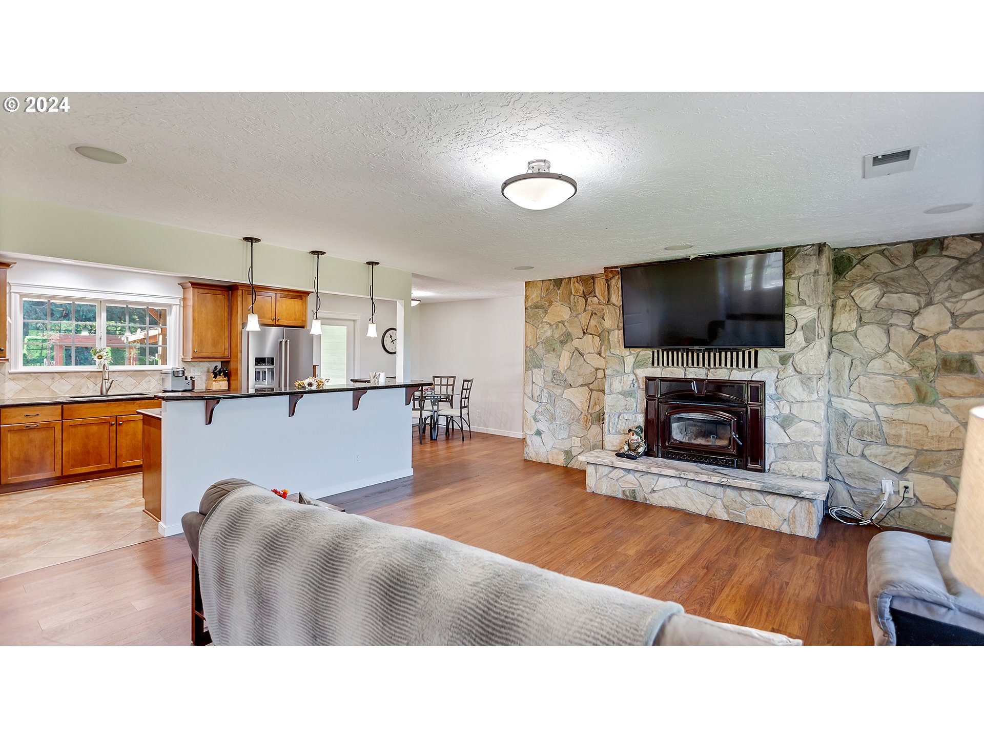 42142 Southeast Trubel Road Sandy, OR 97055 - Photo 3 of 48 a living room with furniture and a flat screen tv