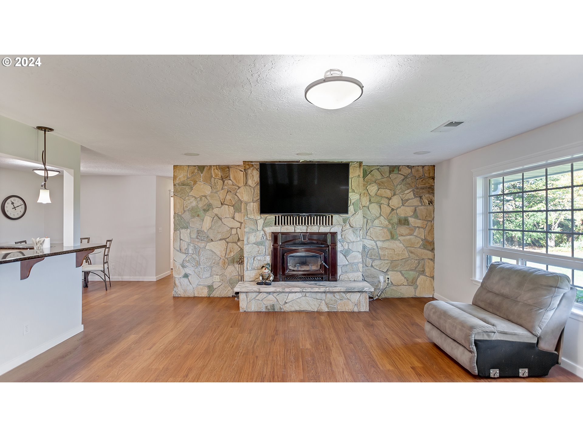42142 Southeast Trubel Road Sandy, OR 97055 - Photo 4 of 48 a living room with furniture and a fireplace