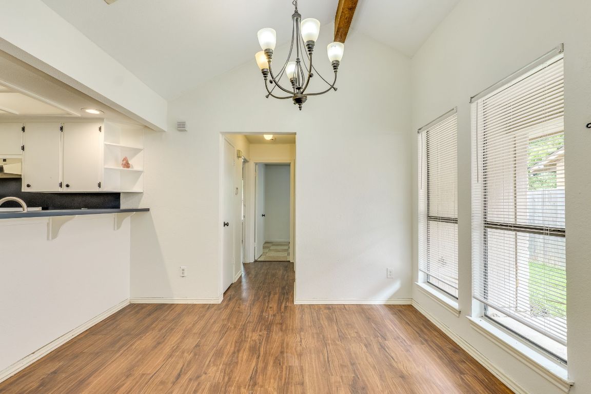 16041 Stoneham Circle Pflugerville, TX 78660 - Photo 11 of 34 a view of empty room with wooden floor and fan