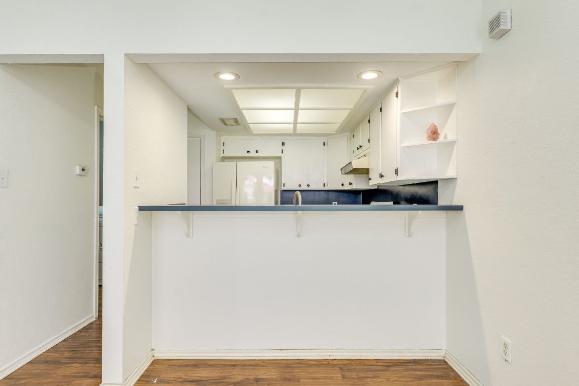 16041 Stoneham Circle Pflugerville, TX 78660 - Photo 12 of 34 a view of a kitchen with a sink