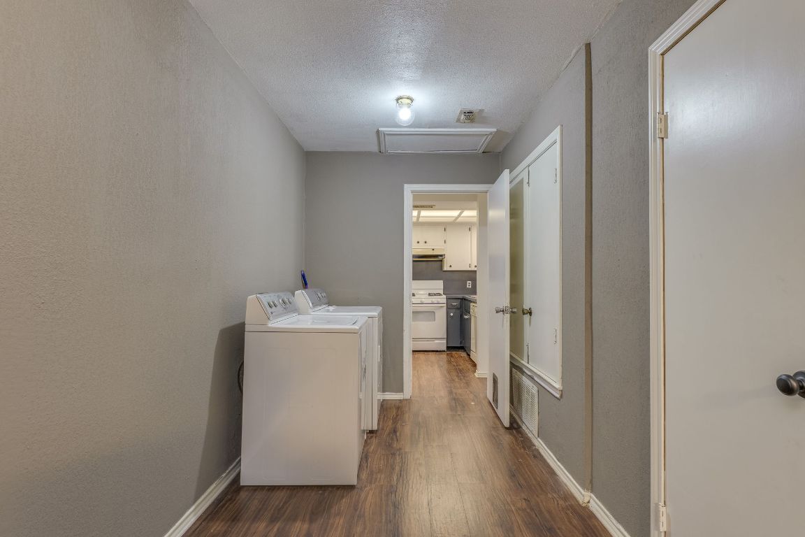 16041 Stoneham Circle Pflugerville, TX 78660 - Photo 25 of 34 a view of a hallway with wooden floor