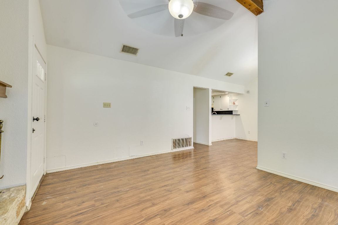 16041 Stoneham Circle Pflugerville, TX 78660 - Photo 8 of 34 a view of an empty room and wooden floor