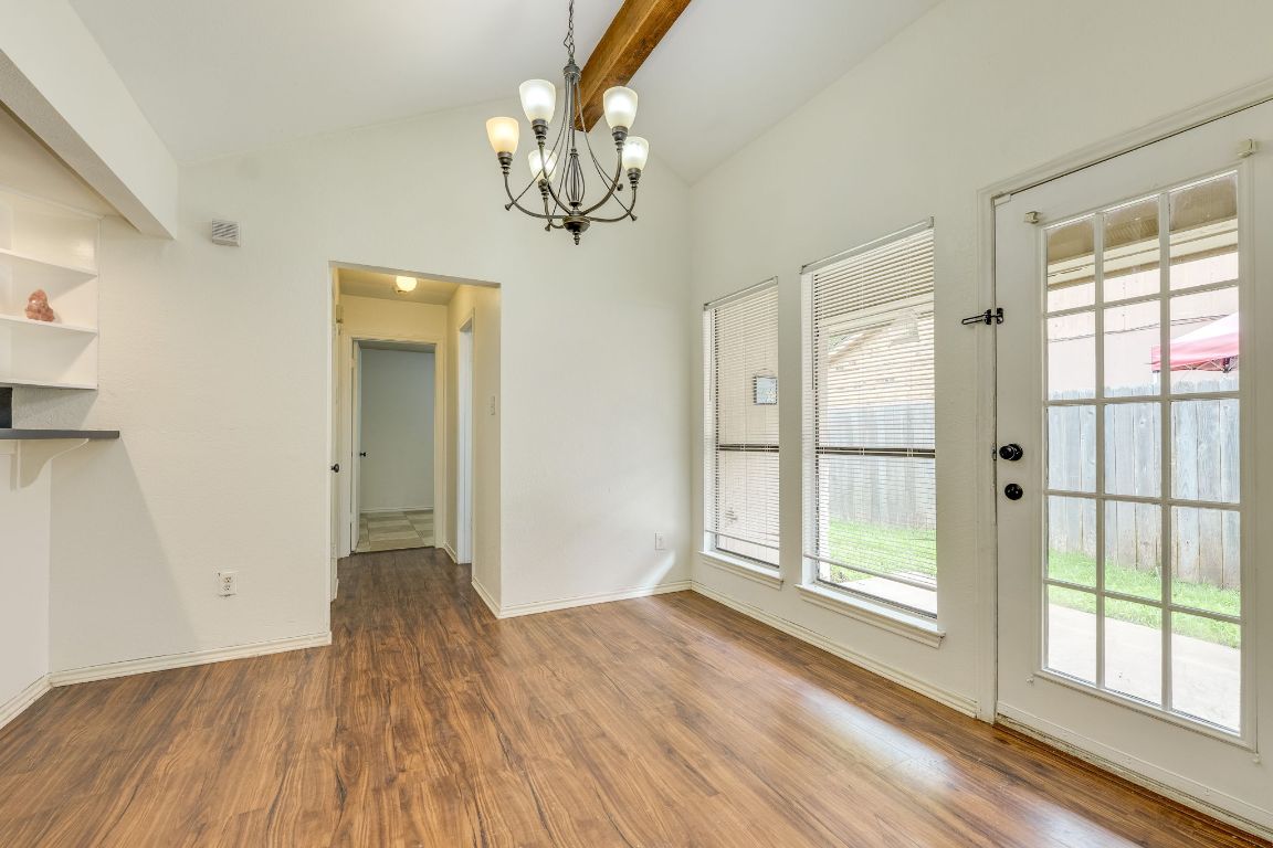 16041 Stoneham Circle Pflugerville, TX 78660 - Photo 10 of 34 a view of empty room with wooden floor and fan