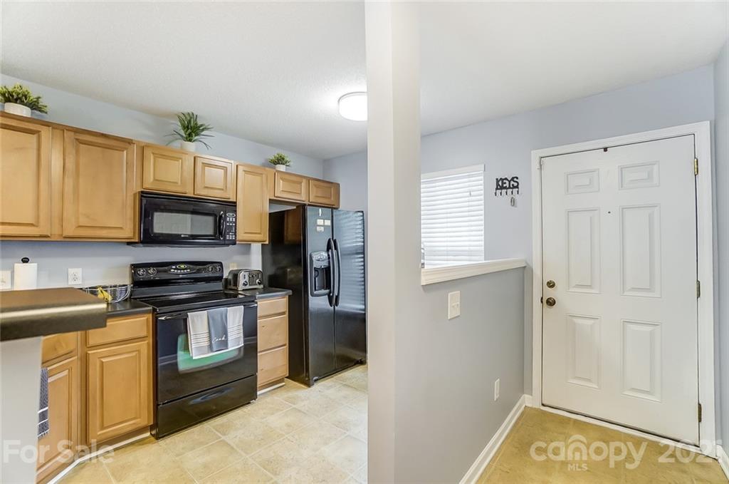 1545 Maypine Commons Way Rock Hill, SC 29732 - Photo 11 of 26 a kitchen with stainless steel appliances granite countertop white cabinets and refrigerator
