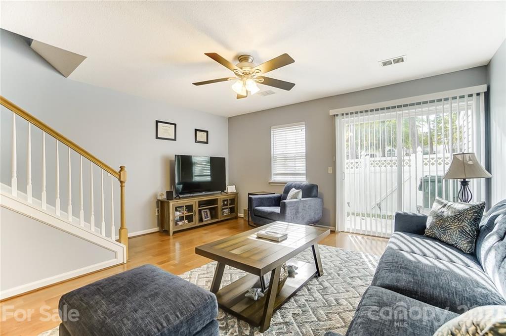 1545 Maypine Commons Way Rock Hill, SC 29732 - Photo 12 of 26 a living room with furniture a flat screen tv and a window