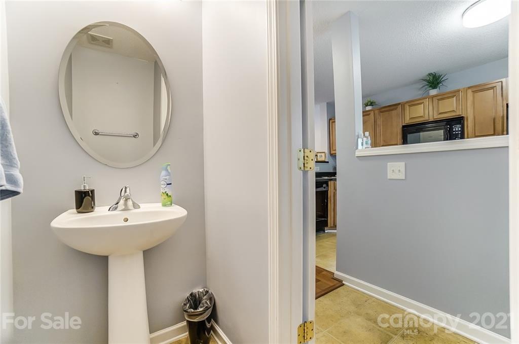 1545 Maypine Commons Way Rock Hill, SC 29732 - Photo 14 of 26 a bathroom with a sink and a mirror