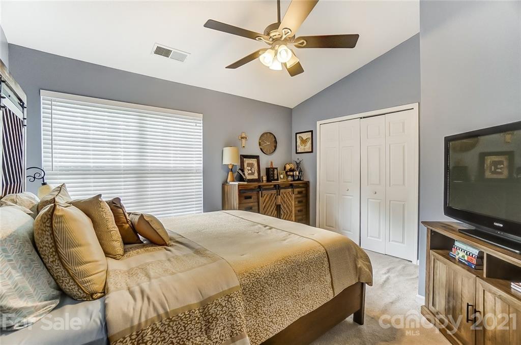 1545 Maypine Commons Way Rock Hill, SC 29732 - Photo 16 of 26 a bedroom with a bed and a flat screen tv