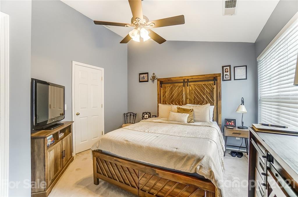 1545 Maypine Commons Way Rock Hill, SC 29732 - Photo 17 of 26 a bedroom with a bed and a flat screen tv