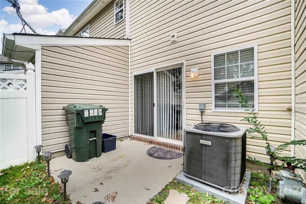 1545 Maypine Commons Way Rock Hill, SC 29732 - Photo 26 of 26 a view of a patio with table and chairs with wooden fence