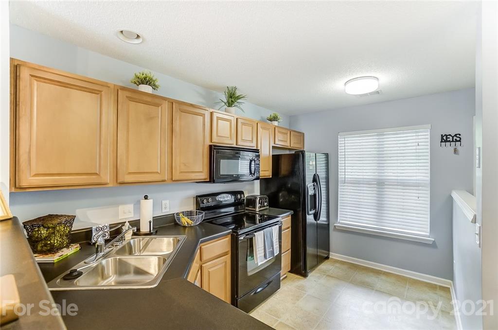 1545 Maypine Commons Way Rock Hill, SC 29732 - Photo 6 of 26 a kitchen that has a sink and a stove