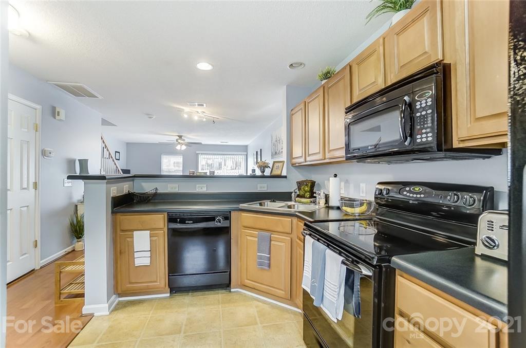 1545 Maypine Commons Way Rock Hill, SC 29732 - Photo 8 of 26 a kitchen with a stove sink and cabinets