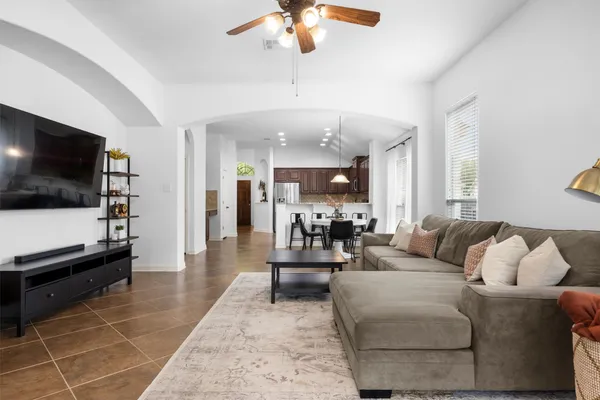 a living room with furniture and a window