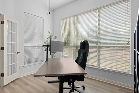 a bedroom with a bed and a mirror