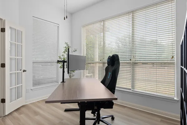 a bedroom with a bed and a mirror