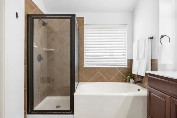 a bathroom with a granite countertop sink and a mirror with toilet