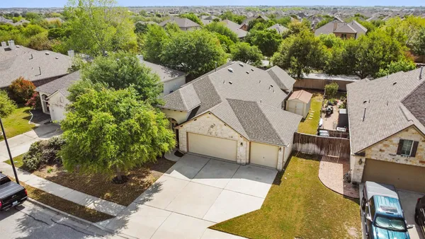 an aerial view of residential building with outdoor space and swimming pool