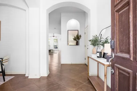 a kitchen with a sink a stove and cabinets